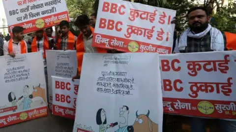 EPA Activists from the Hindu Sena group protest with placards reading "BBC quit India" and "BBC beating day" outside the BBC office in Delhi, 15 February