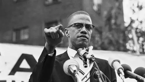 Getty Images Malcolm X speaks at a rally