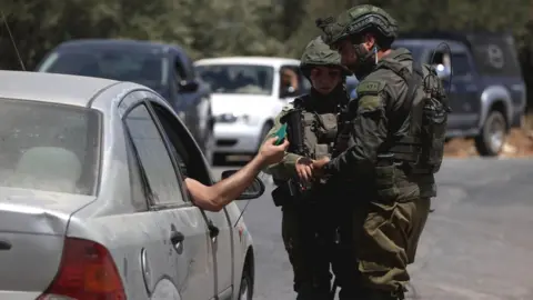 Getty Images Israeli forces close all entrances and exits to Burqa due to tensions between Palestinians and Jewish settlers in Burqa village of Ramallah, West Bank