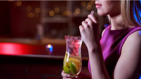 Getty Images Woman drinking