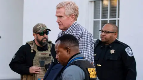 Reuters Alex Murdaugh is led out of the Colleton County Courthouse