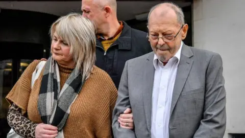 PA Media Geoffrey Bran with his daughter Rhiannon leaving court