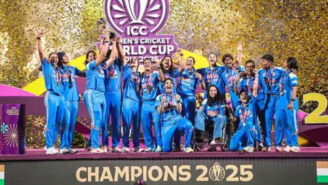 Getty Images Players of Team India celebrate and lift the World Cup trophy during the ICC Women's Cricket World Cup India 2025 Final match between India and South Africa at Dr. DY Patil Sports Academy on November 02, 2025 in Navi Mumbai, India. 