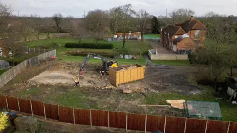 Andy Meeson/BBC The area which housed the unauthorised spa building is now clear