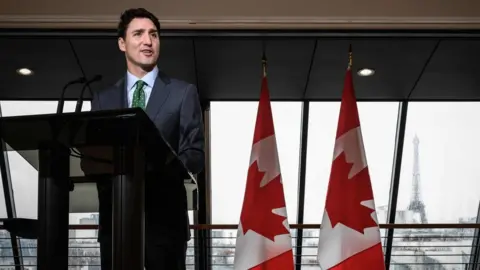 AFP Justin Trudeau speaks to reporters at the Canadian embassy in Paris