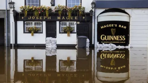 PA Media Floodwater outside Joseph Magee's pub in Newry