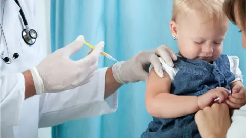 Science Photo Library Toddler being given a vaccination