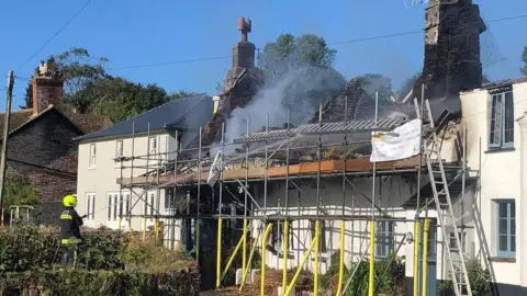 Smoke coming from pub roof