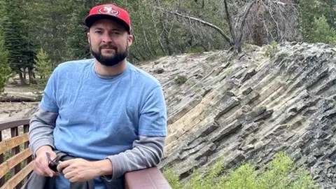 Carlos Oyarbide Teacher Carlos Oyarbide standing on a bridge