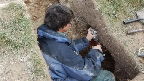 Mike Allen Soil samples being taken from the giant