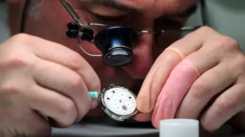 Getty Images A worker at Swiss watch company Tag Heuer