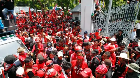 Getty Images Protesters in red shirts