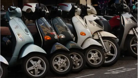 Ian Nicholson, Press Association Row of scooters parked in London (file photo)