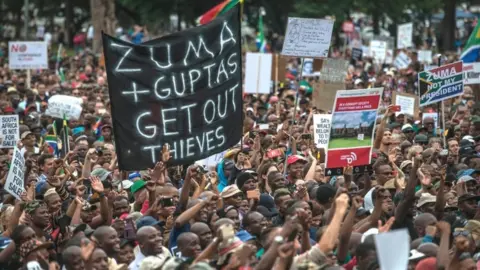 AFP/Getty Images Tens of thousands of South Africans from various political and civil society groups march to the Union Buildings to protest against South African president and demand his resignation on April 7, 2017 in Pretoria.