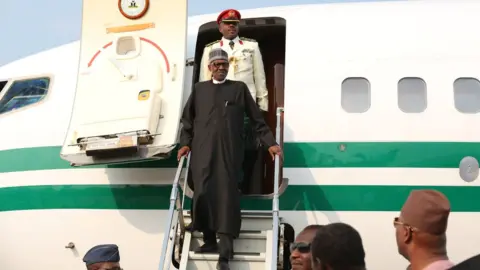 AFP President Buhari leaving the plane in Abuja, Nigeria on 19th August 2017