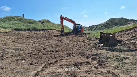 Cornwall Wildlife Trust A digger at Penhale Dunes