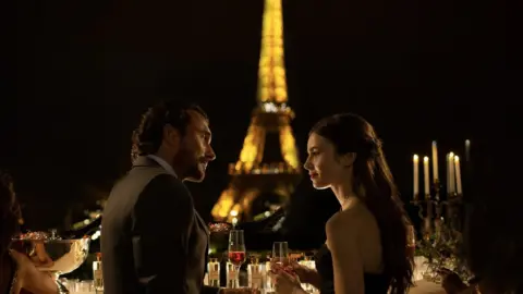 STEPHANIE BRANCHU/NETFLIX William Abadie and Lily Collins in Emily in Paris