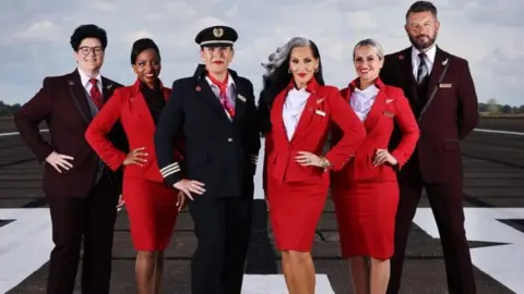 Virgin Atlantic Virgin Atlantic crew wearing gender-neutral uniforms