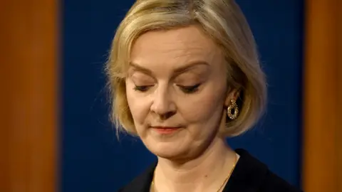 Getty Images Liz Truss talks at a press conference in 10 Downing Street on 14 October 2022 in London