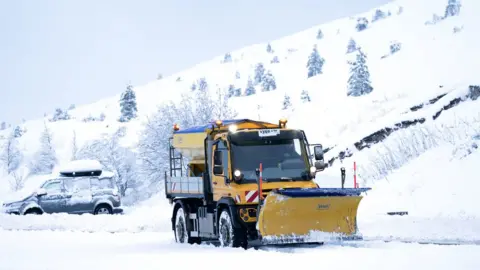 PA Media Snow plough in the Cairngorms