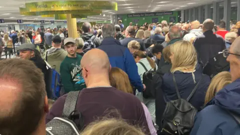 Michelle Ekin Queues at Bristol Airport