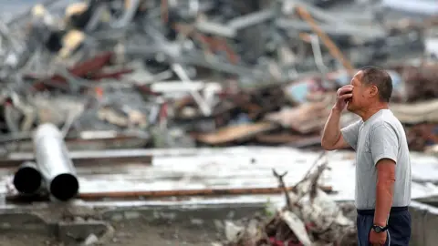 Getty Images Masashi Chiba, 63, cries as he prays for his daugther who worked at Minamisanriku City Hall Disaster Prevention Center and lost her life in the March 11 earthquake and tsunami on June 11, 2011 in Minamisanriku, Miyagi, Japan.