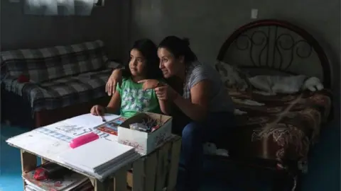Reuters Karina Fuentes helps her daughter Julieta, 7, during a televised class as millions of students returned to classes virtually after schools were ordered into lockdown in March, due to the coronavirus disease (COVID-19) outbreak, in Chilcuautla, Hildalgo state, Mexico August 24, 2020.