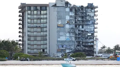Reuters View of the partially collapsed residential building as rescue operations are stopped, in Surfside, Florida, 4 July 2021