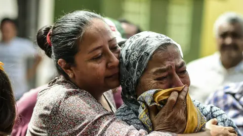 Getty Images Distraught relatives in Mexico