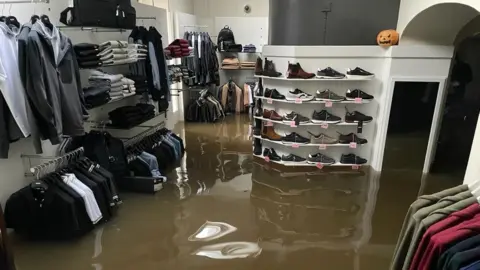 McCartan Bros The flooded interior of McCartan Bros clothes shop in Newry