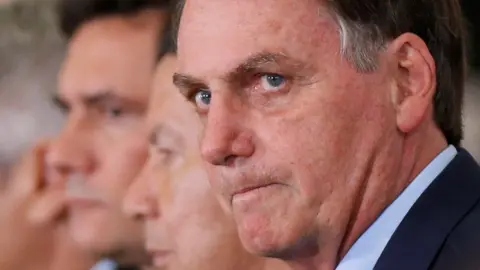 Reuters Brazil's President Jair Bolsonaro attends the ceremony marking his 400 days in office on 5 February