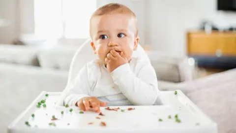 Getty Images Generic image of baby eating off high chair