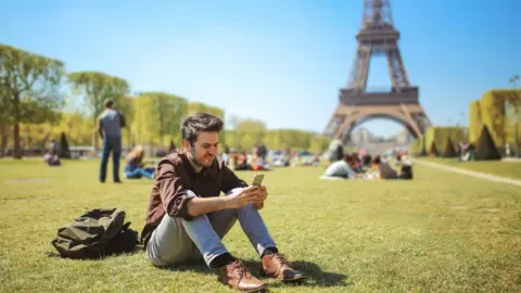 Getty Images Eiffel tower and mobile phone