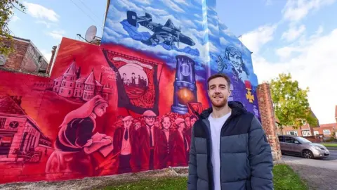 Sunderland City Council Mark with the mural in Ryhope