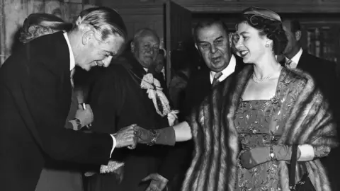 Getty Images The Queen shakes hands with Sir Anthony Eden