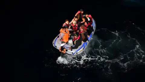 Getty Images Migrants on a boat