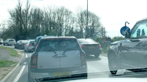 Alison Hamilton Traffic queueing to reach the Humber Bridge