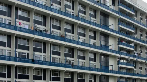 A photograph of Symington House, a five-storey modernist block of council flats in Elephant and Castle, London