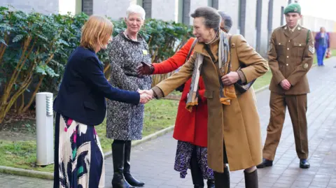 PA Media Princess Anne shaking hands with staff at Southmead Hospital