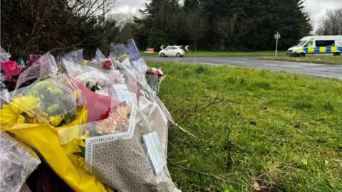 Floral tributes have been left at the site of the crash