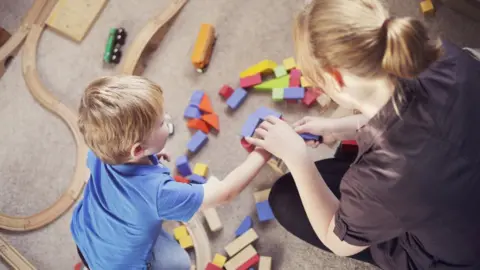 Getty Images Child playing with toys