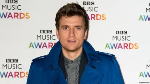 Getty Images Greg James presents the Official Singles Chart on BBC Radio 1 on Friday afternoons