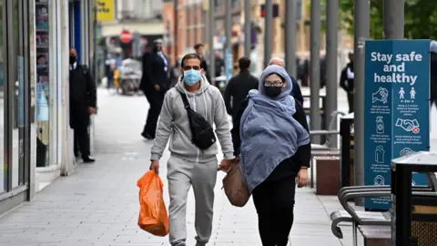 AFP People walking in Leicester