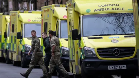 Reuters Military personnel and ambulance worker amid the strike on Wednesday