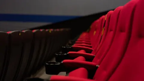 Getty Images Red seats at the cinema