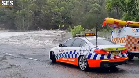 Police car near flood water