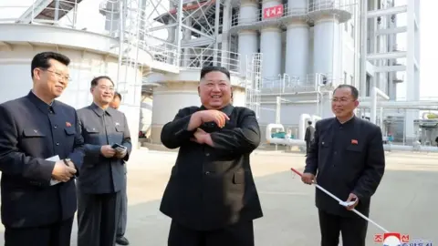 AFP Kim Jong-un pictured by state media opening a fertiliser factory 1 May 2020