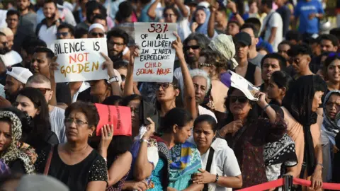 Getty Images Indian demonstrators hold placards during a protest supporting rape-victims.