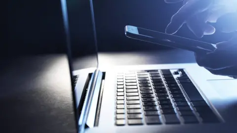 Getty Images Keyboard and phone