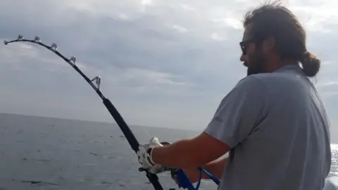 Rik Le Ray reeling in an Atlantic bluefin tuna off Guernsey